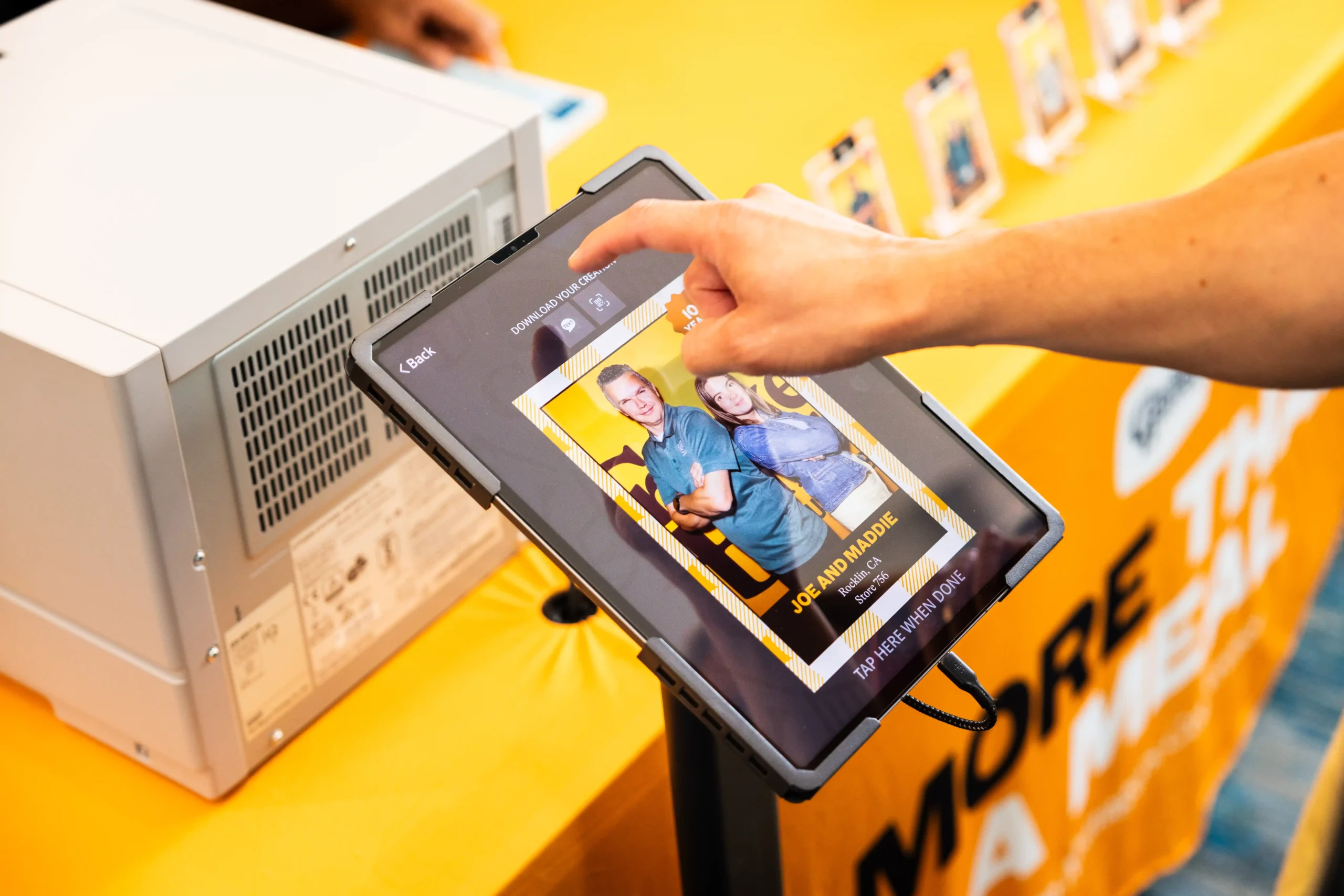 Attendee instantly sharing branded trade show photo booth content